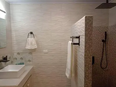 a white bathroom with a sink and a shower at Loft 45 in Playa Hermosa, paradise near the ocean! in Playa Hermosa