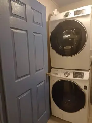 a washer and dryer sitting next to a door at Loft 45 in Playa Hermosa, paradise near the ocean! in Playa Hermosa