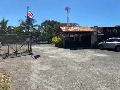 a car parked in front of a building with a gate at Apartamento H Gonzalez 14 free Parking AC wifi in Alajuela City