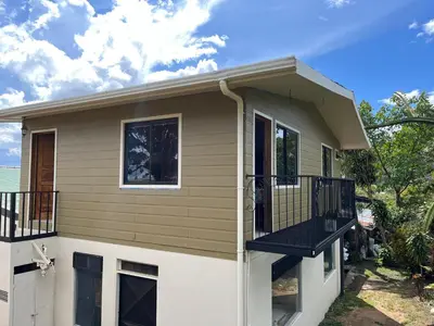 a house with a balcony on the side of it at CASA ISAMAR in Monteverde Costa Rica