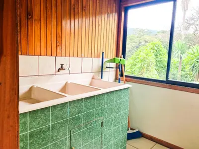 a bathroom with a sink and a window at CASA ISAMAR in Monteverde Costa Rica