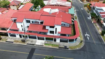 an overhead view of a house with red roof at Don Carlos Place UPPER UNIT in Alajuela City