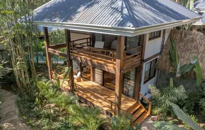 a house with a metal roof at Blue Mist Hotel- Adults Only in Santa Teresa Beach