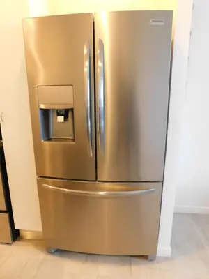 a stainless steel refrigerator with a water dispenser on it at Sunset 205, sleeps six, next door to the pool, 100m to the beach! in Jacó