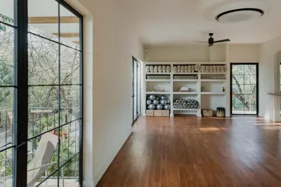 an empty living room with a large glass door at Sendero Hotel in Nosara