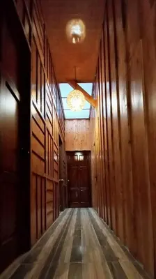 an empty hallway with a door in a building at Eco Finca Tucan in Monteverde Costa Rica