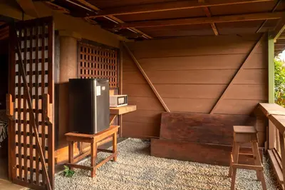 a small room with a tv and a table and a chair at Terraé Eco-Sanctuary in Santa Elena