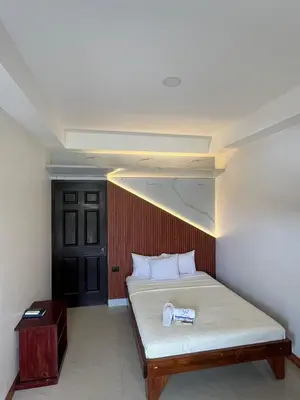 a bedroom with a bed with a box on it at Hotel Wilson Upala in Upala