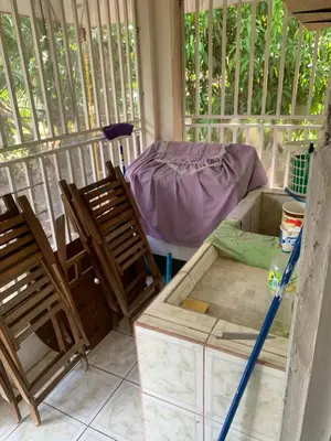 a room with two chairs and a table and a bed at Beach house Matapalo Santa Cruz in Matapalo