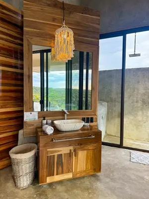 a bathroom with a sink and a large mirror at Destino Hotel & Hot Springs - Lujoso hotel en Provincia Guanacaste, San Bernando de Bagaces, Bagaces in Bagaces