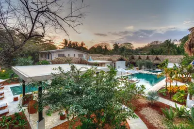 an aerial view of a resort with a swimming pool at The Gilded Iguana in Nosara