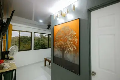 a hallway with a large painting on the wall at Vista del Pacifico Boutique Hotel in Quepos