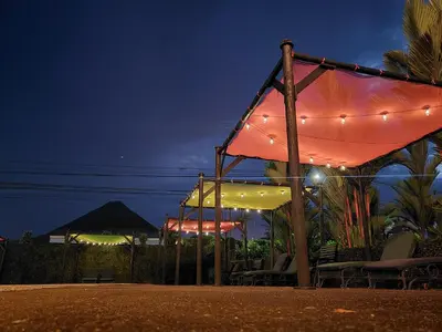 a tent with lights on it at night at San Bosco Inn in Fortuna