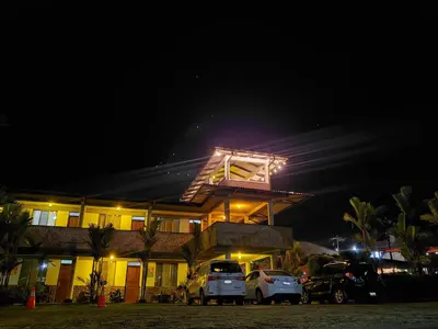 a house with cars parked in front of it at night at San Bosco Inn in Fortuna