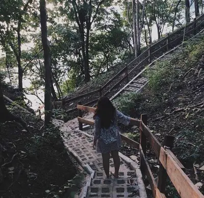 a young girl walking up a set of stairs at Hotel Esperanza in Carrillo