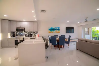 a kitchen and living room with a table and chairs at Del Mar 1G 3 bdr Ocean View in Los Suenos in Herradura