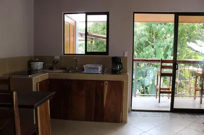 a kitchen with a sink and a counter top at Cabina equipada cerca de río y montañas Tulín Azul in Tulín