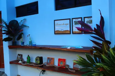 a room with wooden shelves on a blue wall at Cabina equipada cerca de río y montañas Tulín Azul in Tulín