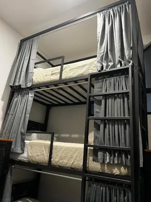 a bunk bed in a room with two bunk beds at Hotel Arenal by Regina in Fortuna