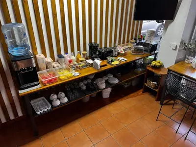 a kitchen with a counter with food on it at Hotel Arenal by Regina in Fortuna