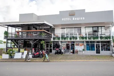 a hotel karuizawa with motorcycles parked outside of it at Hotel Arenal by Regina in Fortuna