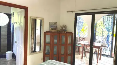 a room with a door with stained glass windows at Casa Maiana in Sámara