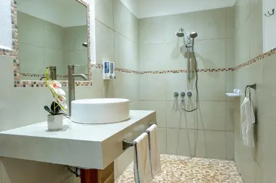 a bathroom with a sink and a shower at Casa Mapache in Tamarindo