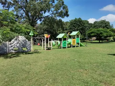 a park with a playground and a play structure at Casa Cafetal Aeropuerto in Alajuela City