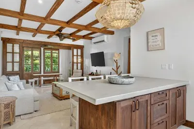 a kitchen with a large island in a living room at Plaza Carlota 22 At Las Catalinas in Playa Danta