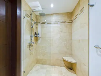a bathroom with a shower with a sink at 360 Splendor 307F Ocean View 3Br Breakfast in Playa Flamingo