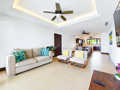 a living room with a couch and a ceiling fan at 360 Splendor 307F Ocean View 3Br Breakfast in Playa Flamingo