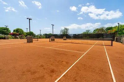 a tennis court with two tennis rackets on it at Casa Serena - Ocean View 3 Br House in Brasilito