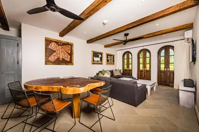 a living room with a table and a couch at Plaza Carlota 4 At Las Catalinas-1 Br Sofa Bed in Playa Danta