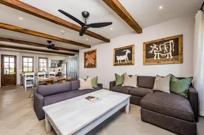 a living room with two couches and a table at Plaza Carlota 4 At Las Catalinas-1 Br Sofa Bed in Playa Danta