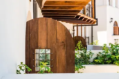 a wooden door on the side of a building at Plaza Carlota 4 At Las Catalinas-1 Br Sofa Bed in Playa Danta
