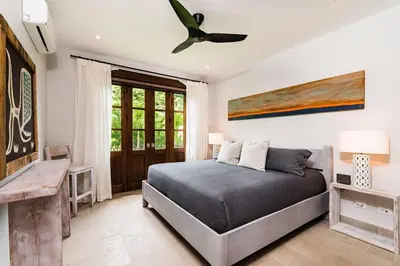 a bedroom with a bed and a ceiling fan at Plaza Carlota 4 At Las Catalinas-1 Br Sofa Bed in Playa Danta