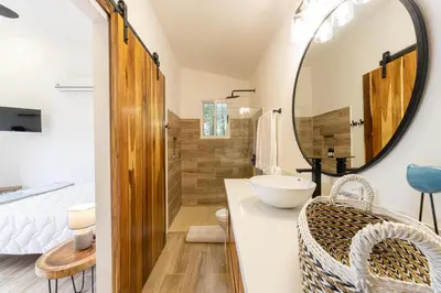 a bathroom with a sink and a mirror at The Haven-Mar Vista 2 Br House With Pool And 1 Br Casita in Brasilito