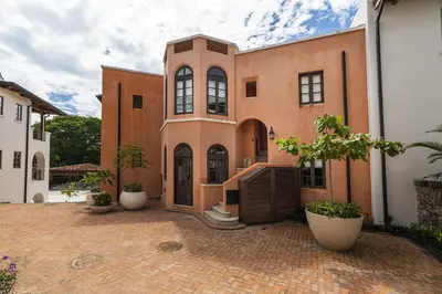 a house with a brick courtyard in front of it at Plaza Mercado 20 At Las Catalinas in Playa Danta