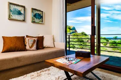 a living room with a couch and a table at Casa Vistas At Mar Vista in Brasilito