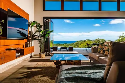 a living room with a couch and a table at Casa Vistas At Mar Vista in Brasilito