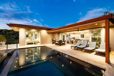 a villa with a swimming pool at night at Casa Natura- 3 Bedroom Ocean View Home At Mar Vista in Brasilito