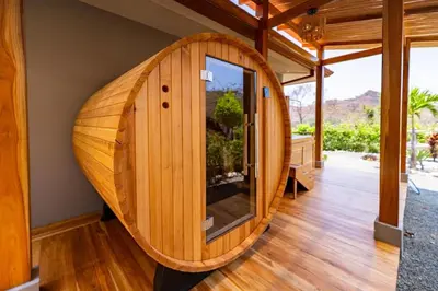 a wooden circular room with a large window in a house at Casa Natura- 3 Bedroom Ocean View Home At Mar Vista in Brasilito
