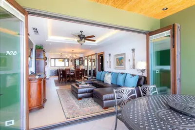 a living room with a couch and a table at 360 Splendor 308F-Ocean View Residence-Breakfast in Playa Flamingo