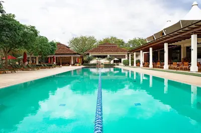 a swimming pool at a resort with blue water at Villa Carao #3 - A Private 4 Bedroom Resort Villa in Brasilito