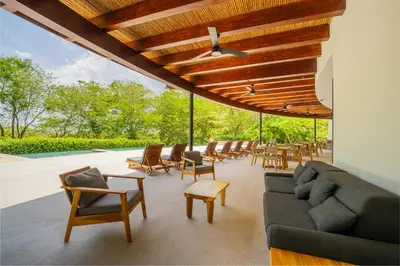 an outdoor living room with a couch and chairs at Villa Carao #3 - A Private 4 Bedroom Resort Villa in Brasilito