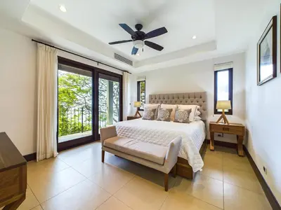 a bedroom with a bed and a ceiling fan at 360 Splendor 309-Ocean View Residence-Breakfast Included! in Playa Flamingo