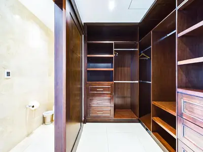a walk in closet with wood paneling at 360 Splendor 309-Ocean View Residence-Breakfast Included! in Playa Flamingo