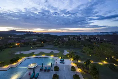 an overhead view of a swimming pool at night at Malinche 423-B, Ocean View 2 Br Condo At Reserva Conchal in Brasilito