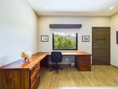 an office with a desk with a chair and a window at Dos Rios #70- 6 Bedroom Home On 12 Acre in Brasilito