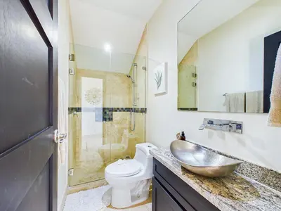 a bathroom with a sink and a toilet at Dos Rios #70- 6 Bedroom Home On 12 Acre in Brasilito